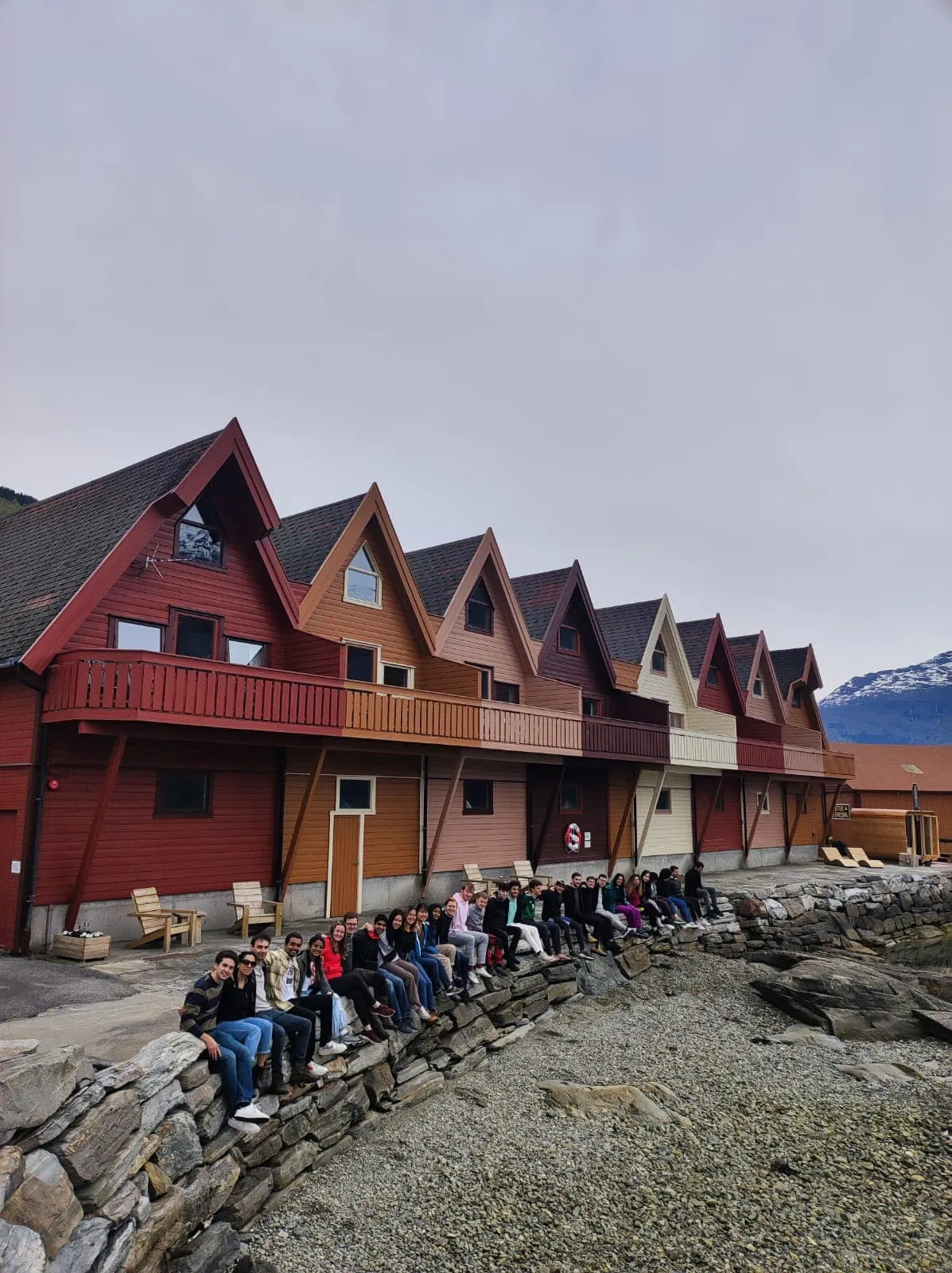 Group photo outside cabins on Luster Fjord in Norway